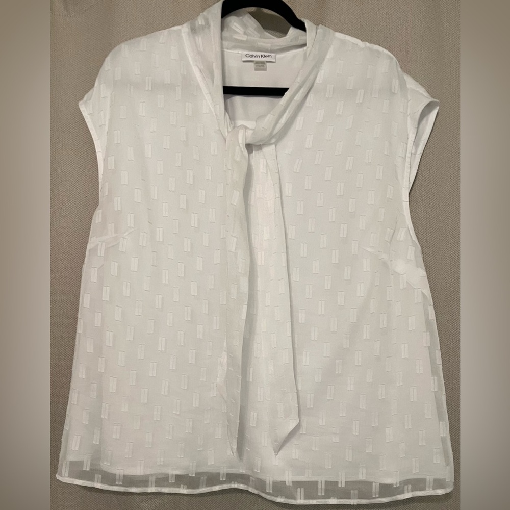 Bright white sleeveless top.